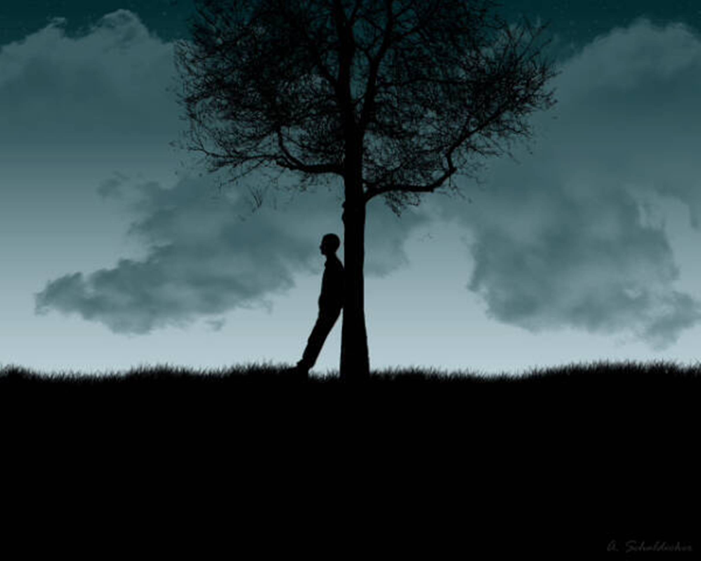 Человек стоит под деревом